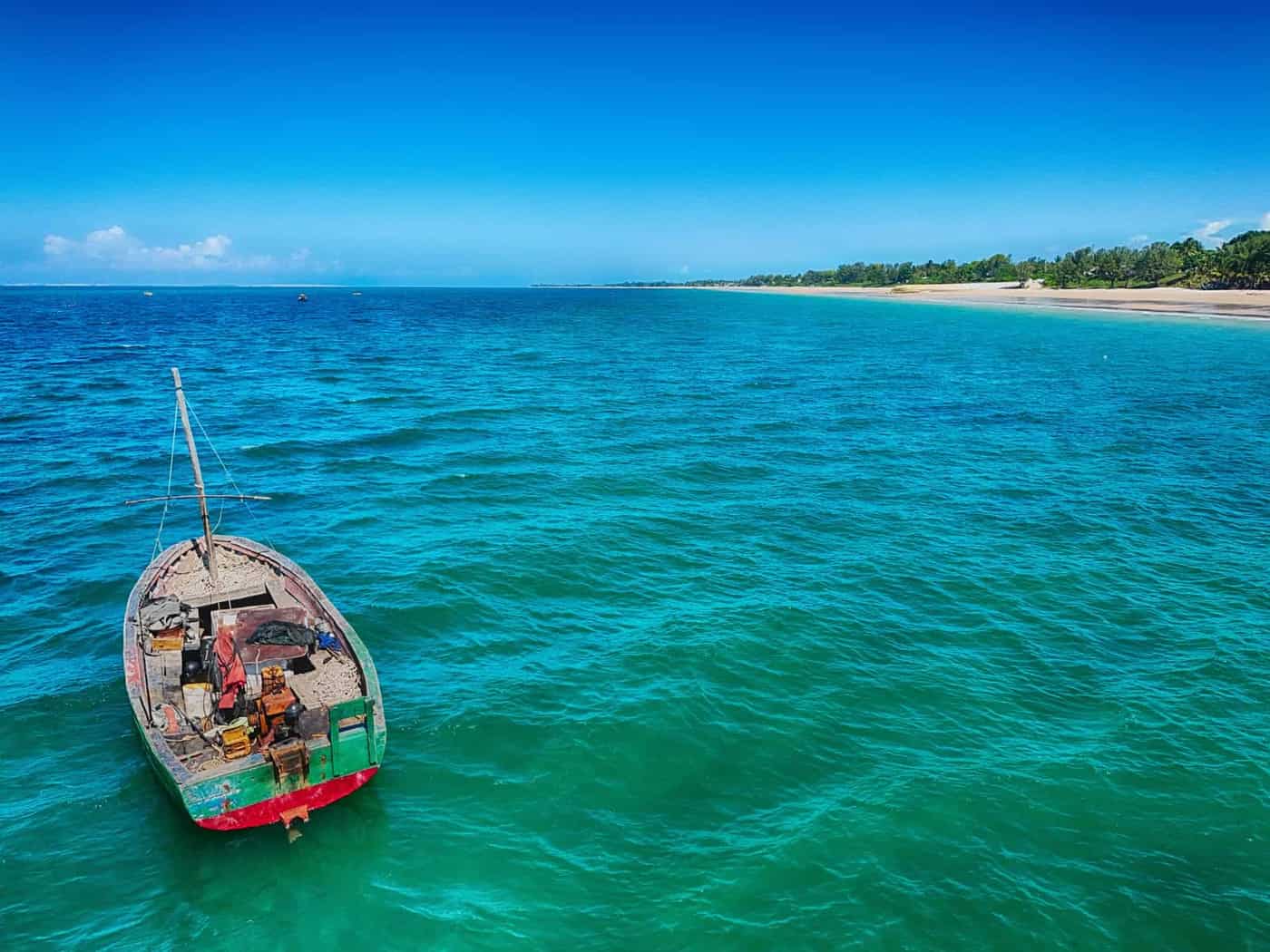 Fishing boat in turquoise water on the Mozambique coast